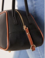 elongated angular bowler bag with contrast piping in black